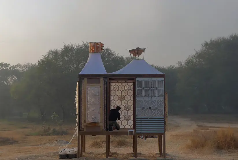 A craft pavilion standing in open ground at Dhun at first light